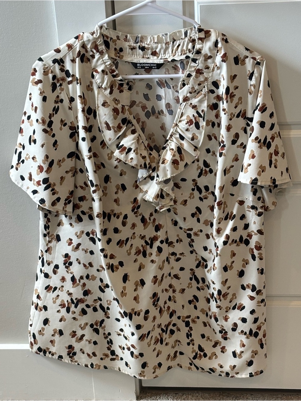 BloomChic Cream Leopard-Spot Ruffle V-Neck Blouse with Brown & Black Spots